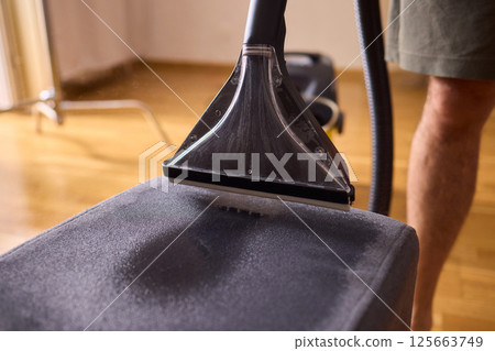 The Professional Upholstery Cleaning Process is in full action, showcasing its effectiveness The Professional Upholstery Cleaning Process is in full action, showcasing its effectiveness 125663749