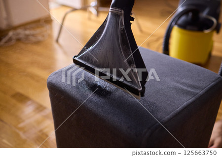 The Professional Upholstery Cleaning Process is in full action, showcasing its effectiveness The Professional Upholstery Cleaning Process is in full action, showcasing its effectiveness 125663750