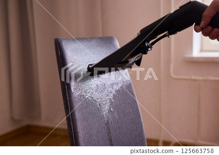The Professional Upholstery Cleaning Process is in full action, showcasing its effectiveness The Professional Upholstery Cleaning Process is in full action, showcasing its effectiveness 125663758