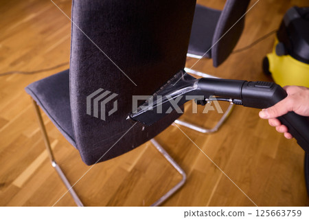 The Professional Upholstery Cleaning Process is in full action, showcasing its effectiveness 125663759