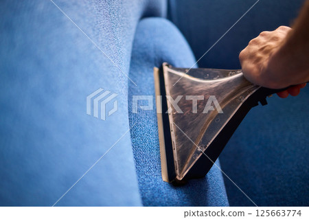 The Professional Upholstery Cleaning Process is in full action, showcasing its effectiveness 125663774