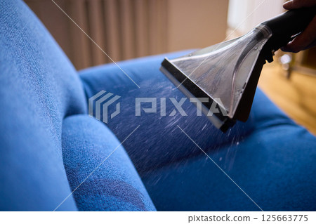 The Professional Upholstery Cleaning Process is in full action, showcasing its effectiveness 125663775