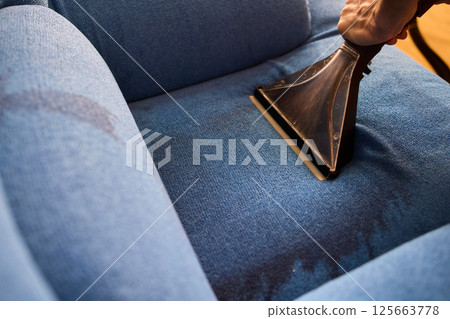 The Professional Upholstery Cleaning Process is in full action, showcasing its effectiveness 125663778