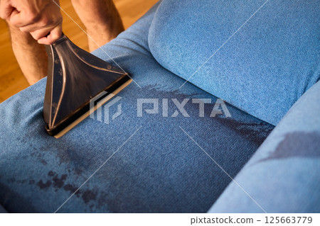 The Professional Upholstery Cleaning Process is in full action, showcasing its effectiveness 125663779