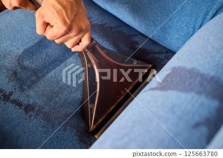 The Professional Upholstery Cleaning Process is in full action, showcasing its effectiveness The Professional Upholstery Cleaning Process is in full action, showcasing its effectiveness 125663780