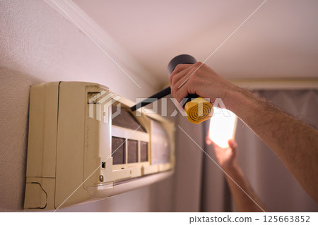 Hands are Actively Engaged in Various Tasks such as Air Conditioning Repair and Ongoing Maintenance Hands are Actively Engaged in Various Tasks such as Air Conditioning Repair and Ongoing Maintenance 125663852