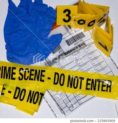 Forensic Scene Tape, Gloves, and Evidence Bag 125663909