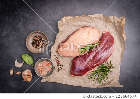 Preparation for cooking raw duck breast 125664574