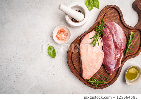 Preparation for cooking raw duck breast 125664585