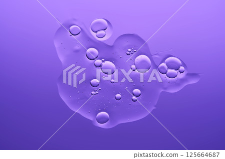 The texture of the serum on a purple background. 125664687