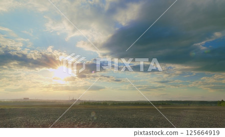 A Breathtaking Sunset Over a Serene Landscape That Captivates the Heart and Soul 125664919