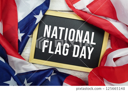 National Flag Day text message with USA flag on wooden background, America national holiday concept National Flag Day text message with USA flag on wooden background, America national holiday concept 125665148