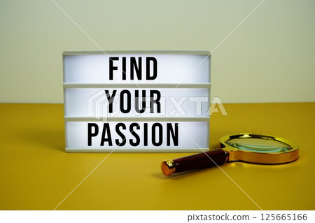 Find Your Passion text on LED lightbox with magnifying glass on yellow background Find Your Passion text on LED lightbox with magnifying glass on yellow background 125665166