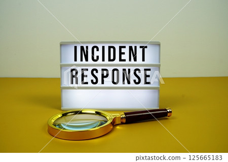 Incident Response text on LED lightbox with magnifying glass on yellow background Incident Response text on LED lightbox with magnifying glass on yellow background 125665183
