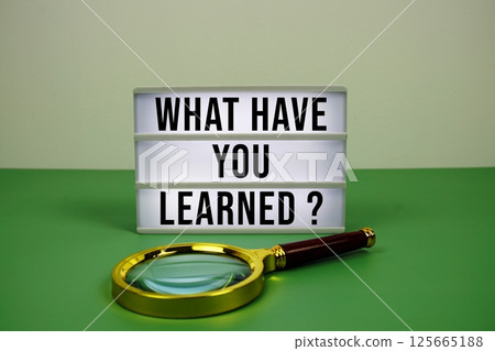 What Have You Learned? text on light box with magnifying glass on green background What Have You Learned? text on light box with magnifying glass on green background 125665188