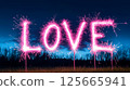 A sparkling representation of the word "Love" illuminated against a dark background through vibrant sparkler effects, symbolizing passion and affection, Valentines Day celebrations. 125665941