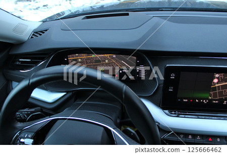 Local Street Map And Car Position Displayed On Central Part Of Car Dashboard With Activated Navigation Local Street Map And Car Position Displayed On Central Part Of Car Dashboard With Activated Navigation 125666462