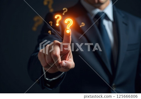 Male finger touches one of many question marks flying in air. Brainstorming and problem-solving. 125666806