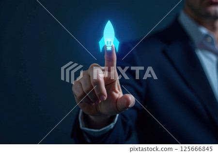 Businessman touching on blue rocket icon launch with up arrow, investment growth, financial success. 125666845