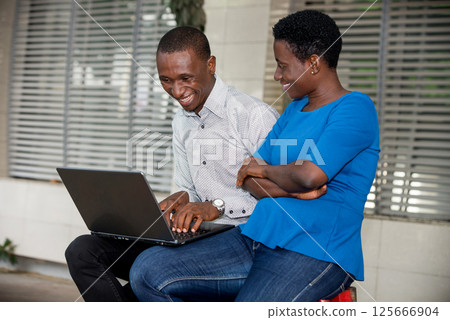 portrait of young people with laptop, happy. 125666904
