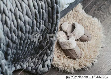 Female soft slippers on faux fur rug Female soft slippers on faux fur rug 125667087