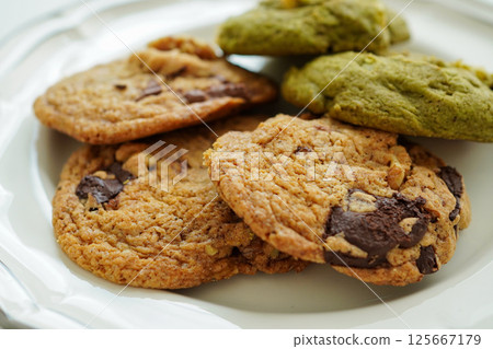 Homemade chocolate walnut cookies and matcha white chocolate cookies 125667179
