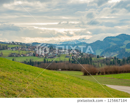 Mogelsberg, Switzerland - December 23rd 2023: View towards the beautiful historic village between hills 125667184