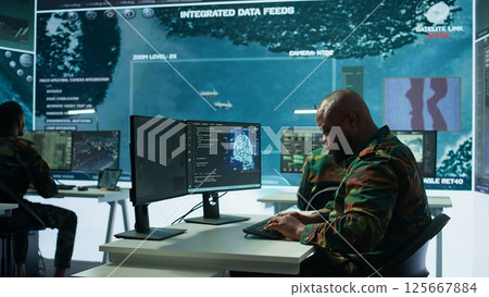 Machine learning specialist monitors satellite data and neural network to collect data for operations. Programming algorithms for cybersecurity and national safety, AI brain visualization. Camera B. 125667884