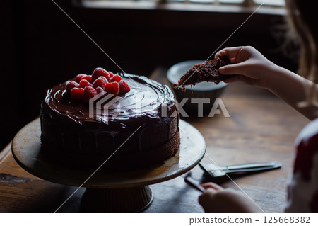 Chocolate cake with raspberries, a delicious dessert for sweet indulgence and gourmet celebration 125668382