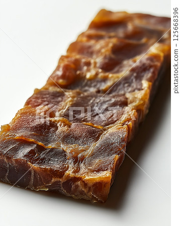 Delicious jerky beef snack featuring dried meat and protein-rich savory tasty food options 125668396