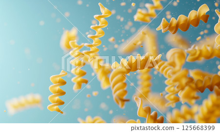 Dynamic closeup of uncooked fusilli pasta spirals as gourmet Italian food background Dynamic closeup of uncooked fusilli pasta spirals as gourmet Italian food background 125668399