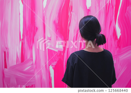 Woman observing pink art painting in modern gallery with vibrant abstract expression and creativity Woman observing pink art painting in modern gallery with vibrant abstract expression and creativity 125668440
