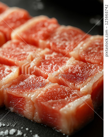 Gourmet raw meat slices showcasing fresh, succulent texture in appetizing cuisine photography Gourmet raw meat slices showcasing fresh, succulent texture in appetizing cuisine photography 125668742