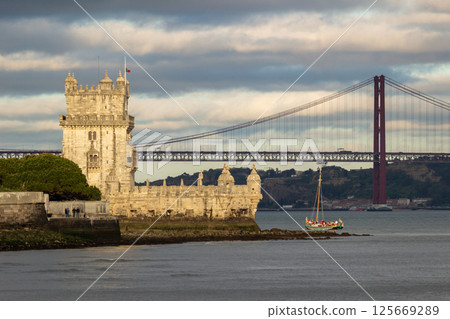 Belem Tower and 25th of April Bridge. Lisbon, Portugal 125669289