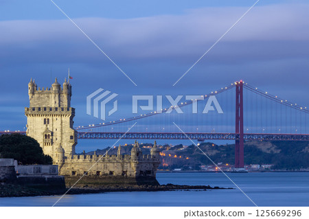 Belem Tower and 25th of April Bridge at Evening Twilight. Lisbon, Portugal 125669296