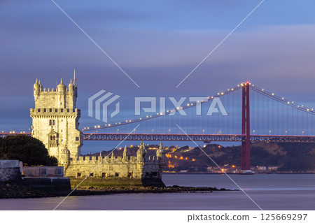 Belem Tower and 25th of April Bridge at Evening Twilight. Lisbon, Portugal 125669297