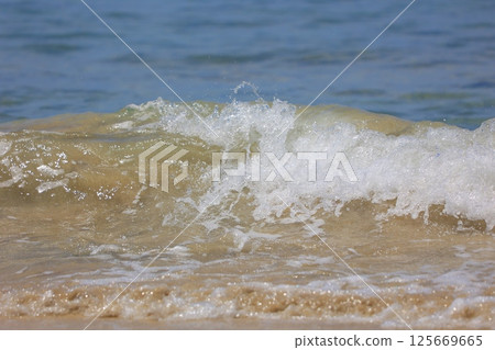 beautiful sandy beach and blue sea beautiful sandy beach and blue sea 125669665