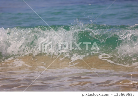 beautiful sandy beach and blue sea beautiful sandy beach and blue sea 125669683