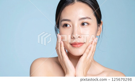 Beauty image: Japanese woman touching her face 125670298