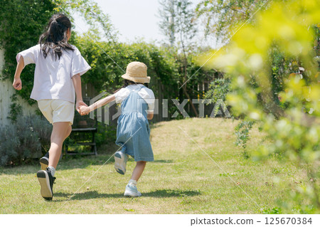 Children running in the park 125670384