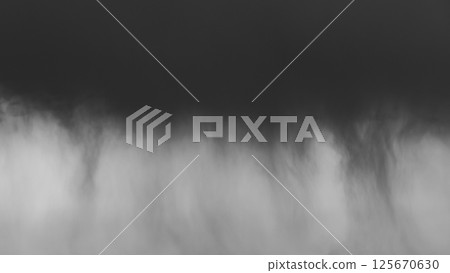 Black clouds and rain showers in the distant sky a-5 monochrome 125670630