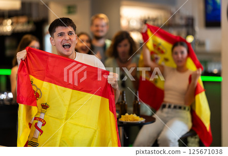 Group of fans in bar with Spanish flag Group of fans in bar with Spanish flag 125671038