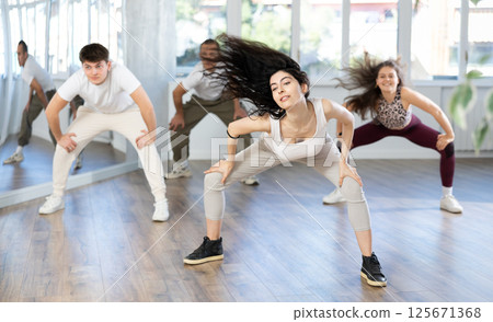Group of young people dancing hip hop Group of young people dancing hip hop 125671368