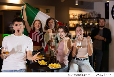 Group of fans in bar with Italian flag 125671486