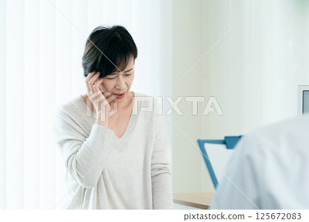 A woman receiving a medical examination A woman receiving a medical examination 125672083