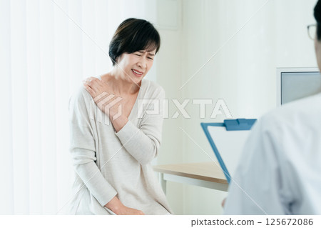 A woman receiving a medical examination A woman receiving a medical examination 125672086