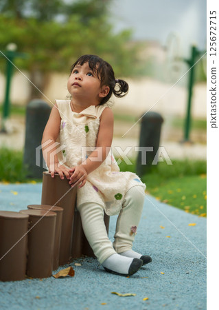 happy toddler girl in park happy toddler girl in park 125672715