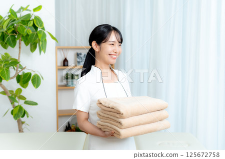 Esthetician young woman Esthetician young woman 125672758
