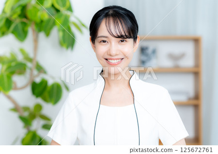 Esthetician young woman Esthetician young woman 125672761