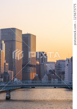 Nakanoshima buildings bathed in the morning glow (from Tosabori Bridge) Nakanoshima buildings bathed in the morning glow (from Tosabori Bridge) 125673775